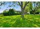 Well-maintained single-story home featuring a vibrant green lawn and mature landscaping for enhanced curb appeal at 623 Circle Ct, Whiteland, IN 46184