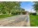 Charming single-story home featuring a well-manicured lawn, mature tree, and a convenient attached carport at 623 Circle Ct, Whiteland, IN 46184