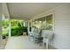 Inviting covered front porch with seating area, perfect for enjoying the outdoors and neighborhood views at 623 Circle Ct, Whiteland, IN 46184