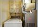 Laundry area featuring classic washer/dryer set with nearby utility and shelving at 623 Circle Ct, Whiteland, IN 46184