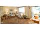 Bright living room with neutral walls, plush sofas, and natural light from the large window at 623 Circle Ct, Whiteland, IN 46184