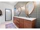 Contemporary bathroom featuring double sink vanity, unique mirrors, and a walk-in shower at 631 1St Nw Ave, Carmel, IN 46032