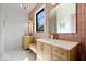 Bathroom featuring a unique backsplash, double sink vanity, and unique pink sconces at 631 1St Nw Ave, Carmel, IN 46032