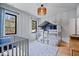 This bedroom features a stylish crib and a unique bunk bed with a cozy, tent-like top at 631 1St Nw Ave, Carmel, IN 46032