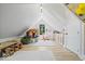 This bonus room features a playhouse, cabinets, and creative decorations at 631 1St Nw Ave, Carmel, IN 46032