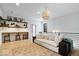 This bonus room features a comfortable couch and a unique workspace with natural light at 631 1St Nw Ave, Carmel, IN 46032