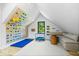 Bright bonus room includes a rock climbing wall, seating area, and natural light at 631 1St Nw Ave, Carmel, IN 46032