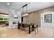 Dining area with a modern chandelier, sleek fireplace, and hardwood floors at 631 1St Nw Ave, Carmel, IN 46032