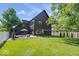 Spacious backyard with a well-maintained lawn and modern home exterior at 631 1St Nw Ave, Carmel, IN 46032