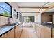 Modern kitchen with a large island, stainless steel appliances, and an open floor plan at 631 1St Nw Ave, Carmel, IN 46032