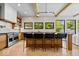 Gourmet kitchen with an island with bar seating, stainless steel appliances, and natural light at 631 1St Nw Ave, Carmel, IN 46032