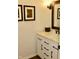 Bathroom features a vanity with a white cabinet and a marble countertop at 6519 Creekside Ln, Indianapolis, IN 46220