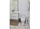 Modern bathroom with floating vanity and toilet at 6519 Creekside Ln, Indianapolis, IN 46220