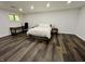 Spacious bedroom features hardwood floors, one window, neutral paint, and a desk at 6519 Creekside Ln, Indianapolis, IN 46220