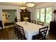 Traditional dining room with an eight-person dining table and lovely overhead lighting at 6519 Creekside Ln, Indianapolis, IN 46220