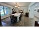 Traditional dining room with hardwood floors, wainscoting, and elegant lighting at 6519 Creekside Ln, Indianapolis, IN 46220