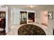 Bright foyer with marble flooring, area rug, and views of the living spaces at 6519 Creekside Ln, Indianapolis, IN 46220