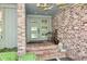Inviting front entrance features brick facade, stylish door, and classic decor at 6519 Creekside Ln, Indianapolis, IN 46220