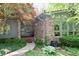 Charming home entrance featuring a brick facade, elegant front door, and manicured landscaping at 6519 Creekside Ln, Indianapolis, IN 46220