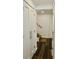 Hallway features hardwood floors and several closet spaces at 6519 Creekside Ln, Indianapolis, IN 46220
