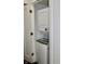 Stacked washer and dryer in the laundry closet at 6519 Creekside Ln, Indianapolis, IN 46220