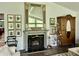 Living room with an elegant fireplace, detailed mantle, and beautiful decor at 6519 Creekside Ln, Indianapolis, IN 46220