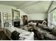 Open living area with hardwood floors, large windows, and comfortable seating at 6519 Creekside Ln, Indianapolis, IN 46220