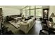 Cozy living room with large windows, comfortable seating, and hardwood floors at 6519 Creekside Ln, Indianapolis, IN 46220