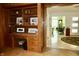 Office area with wooden built-in shelving and cabinets, offering a classic and functional workspace at 6519 Creekside Ln, Indianapolis, IN 46220
