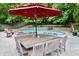 Spacious outdoor patio with a large dining table and seating, perfect for entertaining near the pool at 6519 Creekside Ln, Indianapolis, IN 46220