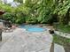 Sparkling pool area with comfortable seating and surrounding greenery, perfect for relaxation and entertainment at 6519 Creekside Ln, Indianapolis, IN 46220