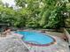 Inviting pool area with surrounding greenery, offering a perfect oasis for relaxation and recreation at 6519 Creekside Ln, Indianapolis, IN 46220
