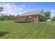 Lush backyard with a wooden deck, perfect for outdoor gatherings and relaxation at 6529 Lakesedge Dr, Indianapolis, IN 46237