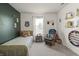 bedroom with cozy sitting chair and decorative shelves showcasing books and toys at 6529 Lakesedge Dr, Indianapolis, IN 46237