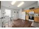 Dining room with eat-in kitchen, wood floors, and an eat-in dining table at 6529 Lakesedge Dr, Indianapolis, IN 46237