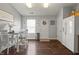 Dining room with eat-in kitchen, wood floors, and a refrigerator at 6529 Lakesedge Dr, Indianapolis, IN 46237