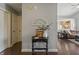 Inviting entryway with a decorative table, a view of the living room and kitchen in the background at 6529 Lakesedge Dr, Indianapolis, IN 46237