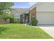 Well-maintained home featuring manicured lawn, landscaping, and brick facade, creating a welcoming curb appeal at 6529 Lakesedge Dr, Indianapolis, IN 46237