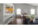 Open-concept living room flows seamlessly into kitchen with breakfast bar and cozy seating at 6529 Lakesedge Dr, Indianapolis, IN 46237