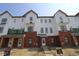New construction townhome with white siding and brick accents at 7063 Pate Hollow Dr, Brownsburg, IN 46112
