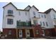 New construction townhome featuring brick accents and white siding at 7071 Pate Hollow Dr, Brownsburg, IN 46112