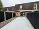 Cozy backyard with concrete patio and exterior door entrance at 7492 Country Brook Dr, Indianapolis, IN 46260