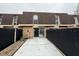 Cozy backyard with concrete patio and exterior door entrance at 7492 Country Brook Dr, Indianapolis, IN 46260