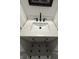 Beautiful bathroom featuring a marble countertop vanity with a black faucet and mosaic tile flooring at 7492 Country Brook Dr, Indianapolis, IN 46260