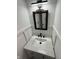 Charming bathroom featuring a white vanity with a marble countertop and a fancy ornate mirror at 7492 Country Brook Dr, Indianapolis, IN 46260