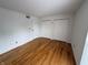 Bedroom with hardwood floors and closet at 7492 Country Brook Dr, Indianapolis, IN 46260