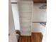 Closet with hardwood floors and built-in shelves at 7492 Country Brook Dr, Indianapolis, IN 46260