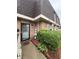 Exterior view of the townhouse with brick facade and mature landscaping at 7492 Country Brook Dr, Indianapolis, IN 46260