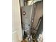 Close up of a gray furnace and water heater, with white door on the left at 7492 Country Brook Dr, Indianapolis, IN 46260