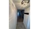 Hallway with hardwood floors and crystal light fixture at 7492 Country Brook Dr, Indianapolis, IN 46260